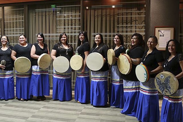 Photo of Oogimah Ikwewok singers performing at MM on Ice event in Winnipeg, Manitoba.